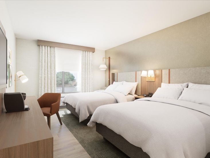 comfortable room with two beds and work desk at the brand-new Holiday Inn Nahville Airport near BNA and I-40.